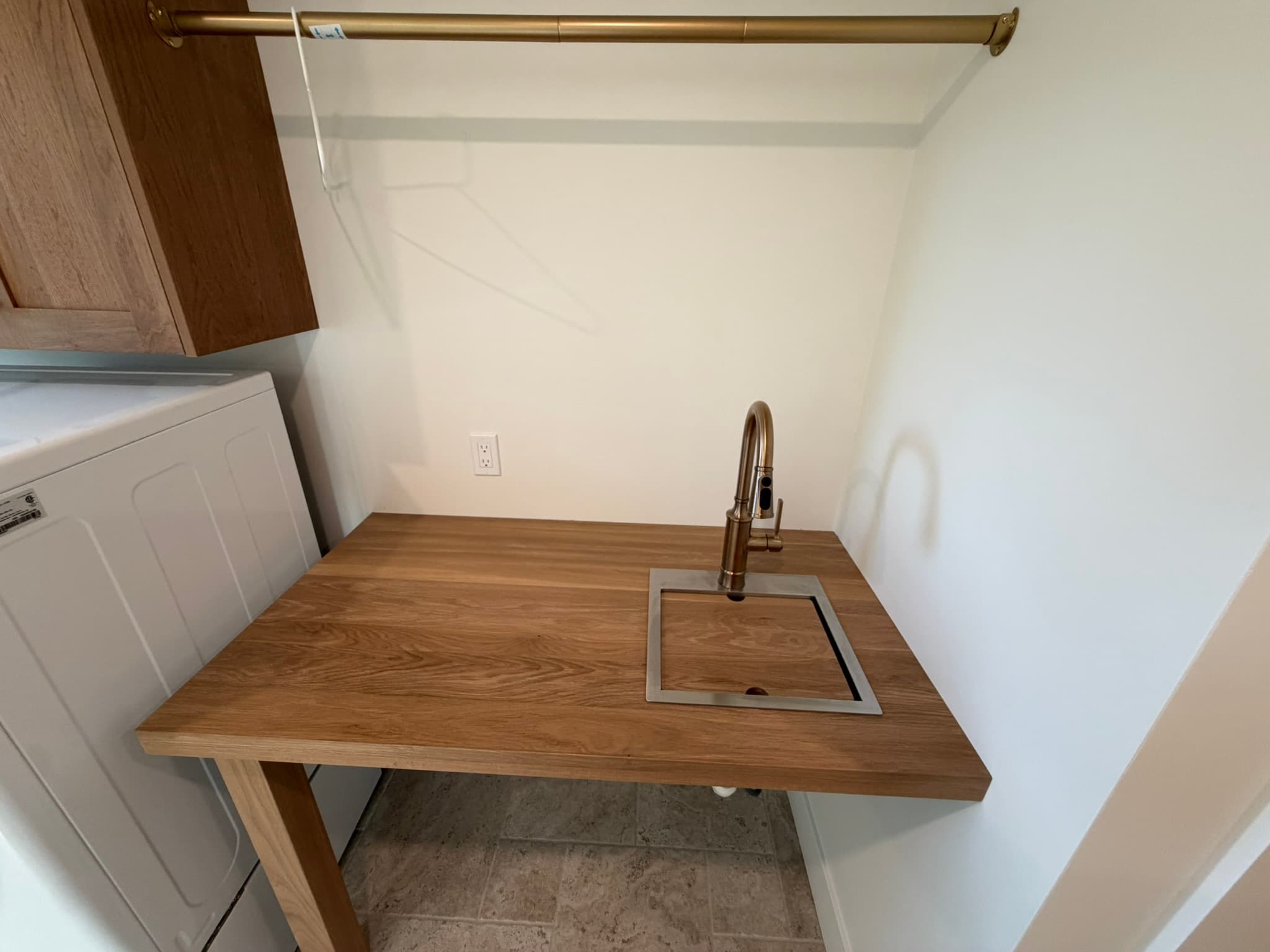 Wet bar with a live-edge wood counter and bar sink