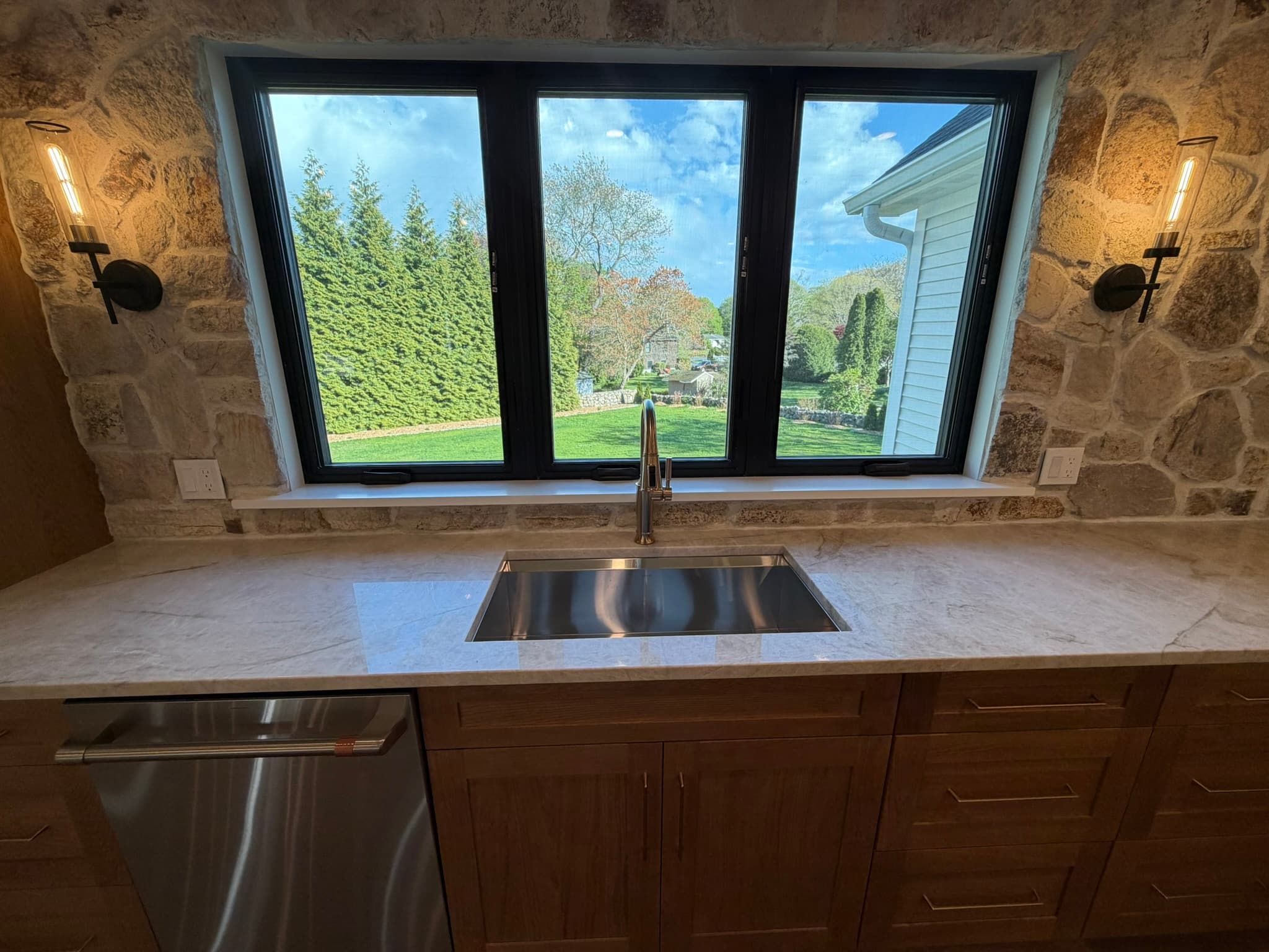 Kitchen sink and window overlooking the green rear yard