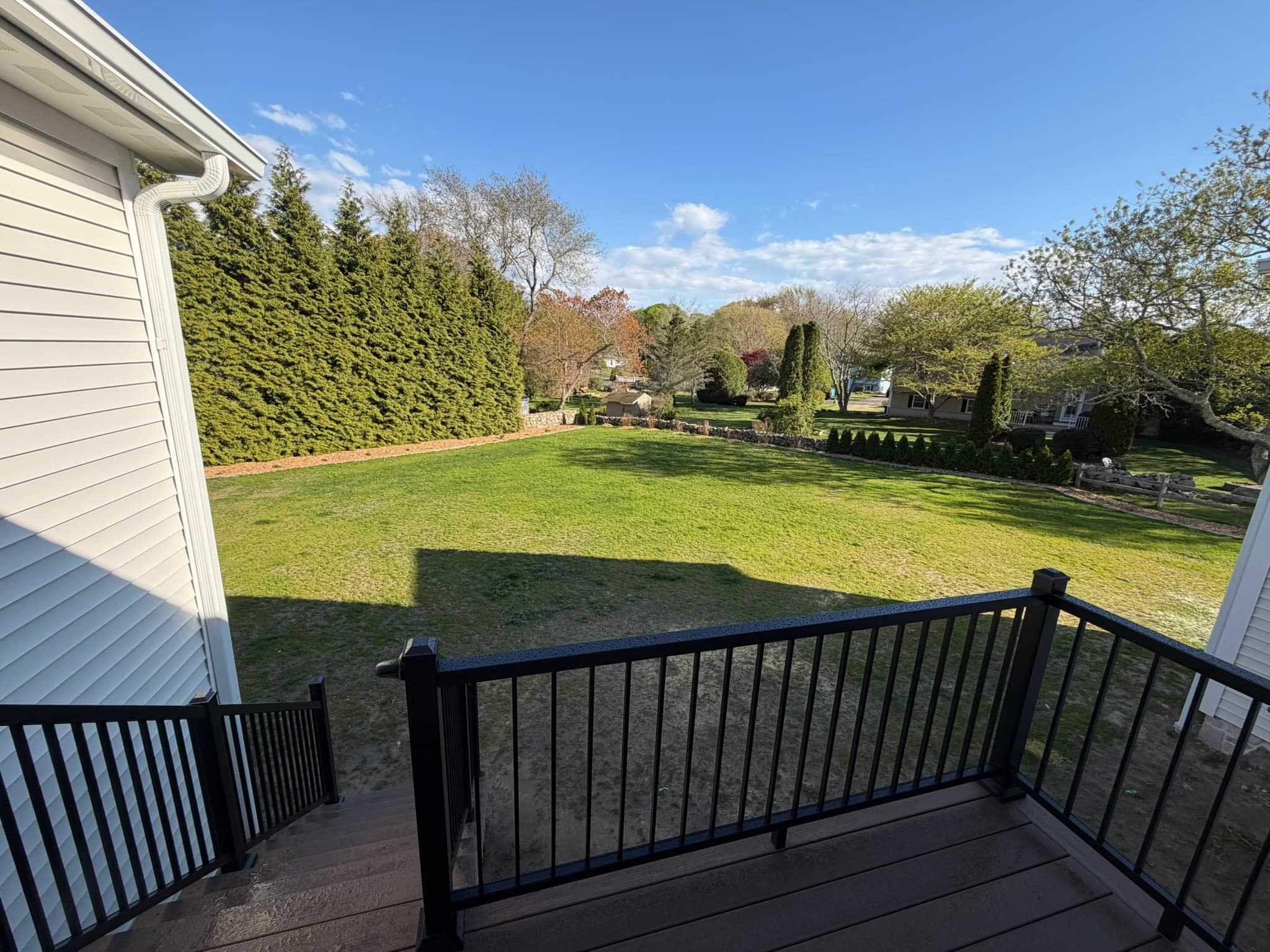 Composite deck overlooking the landscaped rear yard